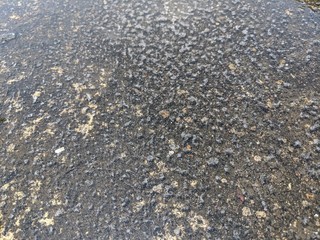 Texture of water on a cement floor, puddles on concrete, top view
