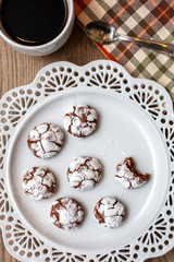 Obraz na płótnie Canvas Chocolate Almond Crinkle Cookies on a White Plate