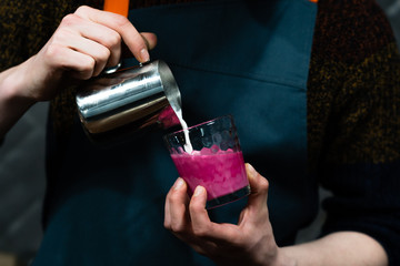 hand with a glass of red wine