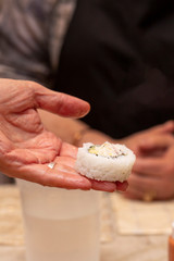 Chef rooling the sushi rice in a demonstration class