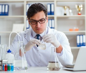Young researcher scientist doing a water test contamination expe