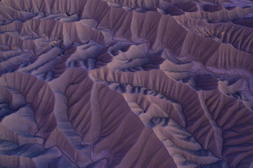 otherworldly abstract texture in dramatic desert badlands