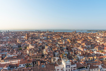 Fototapeta na wymiar Picturesque panoramic view of Venice, Italy. Aerial scenery view with red roofs of houses.