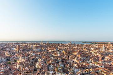 Picturesque panoramic view of Venice, Italy. Aerial scenery view with red roofs of houses.