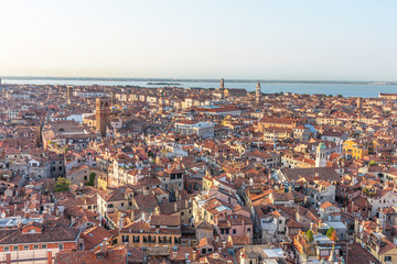 Picturesque panoramic view of Venice, Italy. Aerial scenery view with red roofs of houses.