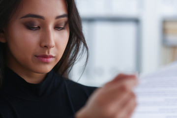 portrait of young brunette business lady study documents paper work concept