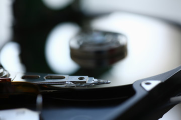 Hard drive from computer or laptop lies on the table in the repair shop. Performs fault diagnostics...