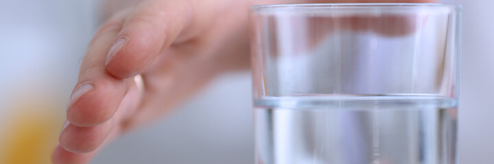 Male arm stretching out to glass in office closeup