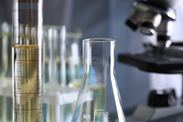 Yellow liquid spilled petrol additive innovative supply. Conveyor line production household cleaning products detergents help cleaning destruction stains pests urine poison antidote vaccine concept.