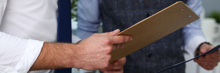 Group of people hold in arms financial papers solve and discuss problem closeup. Fresh view review situation new angle look professional training white collar investment and finance concept