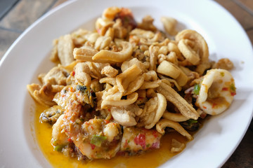 Spicy fried seafood served on plate