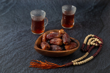  food Ramadan Sweets dried fruits and nuts Tea with a rosary and the on the table white,  Concept: month fasting culture Muslim and prayer for god, Ramadan food symbolic eastern Arabian