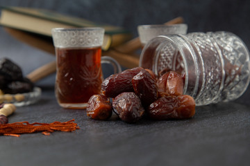  food Ramadan Sweets dried fruits and nuts Tea with a rosary and the on the table white,  Concept: month fasting culture Muslim and prayer for god, Ramadan food symbolic eastern Arabian