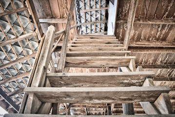 This unique photo shows an old broken wooden staircase in a dilapidated house!