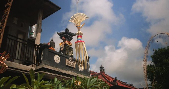 Religious amulet on a pole. Bali temple Indonesia. Traditional indonesian hindu symbol. Ancient religious spiritual symbol decoration waving on wind. Balinese Asian culture. Tourism and travel concept