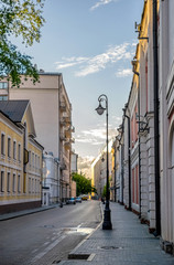 Fototapeta na wymiar Moscow street in quiet historical city center (Kremlin star in background)