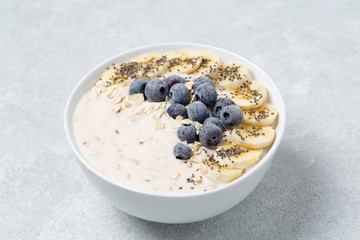 Smoothie bowl with blueberry, chia, banana and yogurt. The concept of healthy eating.