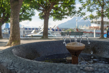 Close up of water at fountain on blurred background, copy space