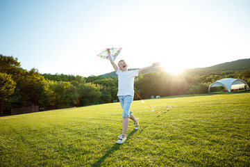 A child in nature plays fun.