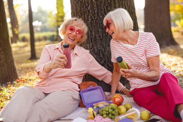 Happy ladies spending time on morning picnic