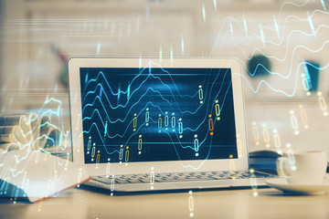 Forex Chart hologram on table with computer background. Double exposure. Concept of financial markets.