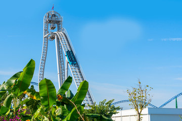 Rides at  amusement Park against a blue sky