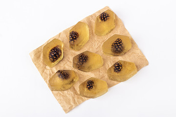 Healthy vegan snack - natural jelly marmalade with pine cone inside on white background.The concept of proper nutrition and healthy eating. Organic and vegetarian sweet dessert no bake. Close up