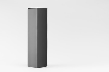 Tall slim elegant black blank rectangle paper box side view on white background, mock up of packing branding product, advertising, presentation, design.