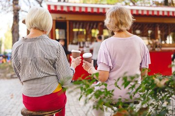 Two friends meeting over a cup of coffee