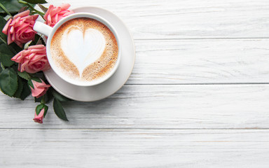 A cup of coffee with heart pattern