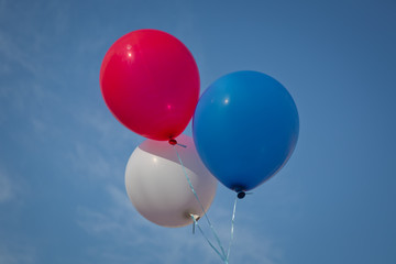 Blue,red, white balloon isolated on a blue background .Blue, red, white balloon sky background .