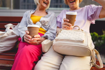 Woman telling her friend funny story from her holiday