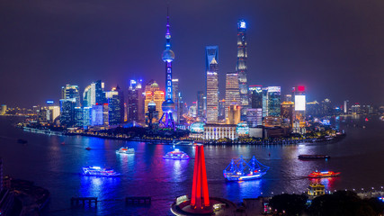 Aerial view Shanghai city skyline and skyscraper, Shanghai modern city at night in China on the Huangpu River.