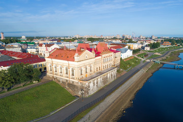 Fototapeta na wymiar View of the old building of the Bread Exchange (1912) on the embankment of the Volga River on a July day (shooting from a quadrocopter). Rybinsk, Russia