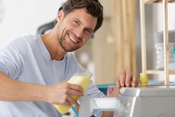happy man doing laundry