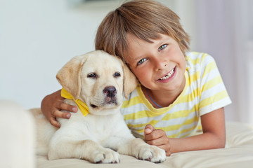 A child with a dog.