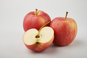Ripe juicy red apples on white background