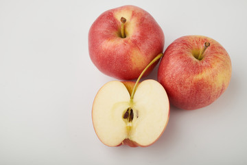 Ripe juicy red apples on white background