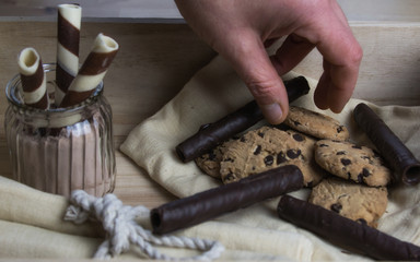 Hand picking cookies and candy. Food, gastronomy and pastries. Close-up