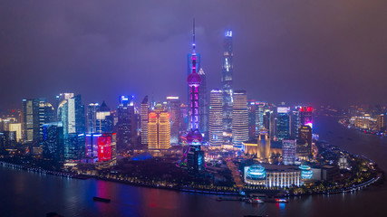 Fototapeta na wymiar Aerial view Shanghai city skyline and skyscraper, Shanghai modern city at night in China on the Huangpu River.