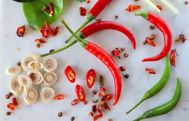 Oriental cuisine, ingredients, onions and tomatoes, garlic and hot chili peppers, lime, spices