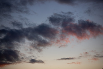 Obraz na płótnie Canvas Blue and red clouds in the sky