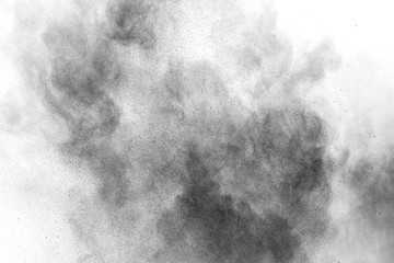 Black powder explosion on white background. Colored cloud. Colorful dust explode. Paint Holi.