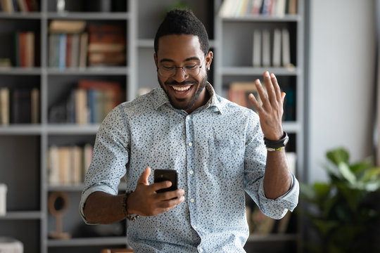 Excited Happy African Businessman Celebrate Read Good News On Smartphone