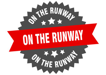 on the runway sign. on the runway circular band label. round on the runway sticker