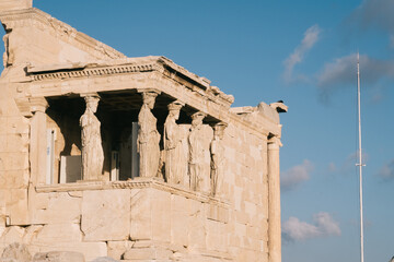 Obraz premium Athens, Greece - Dec 20, 2019: Erechtheion Temple with Caryatids, Caryatid Porch, Acropolis, Athens, Greece