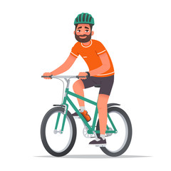 Fototapeta premium Happy man dressed in sportswear and a helmet rides a bicycle. Bike ride. Cyclist. Leisure and Active holiday