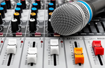 Microphone on the audio mixer. Close up. Sound craft.