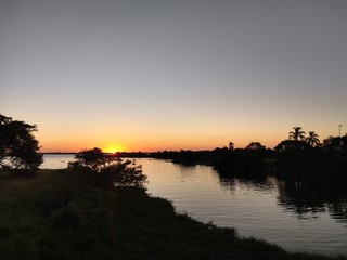 Fototapeta na wymiar beautiful sunset on the edge of the river