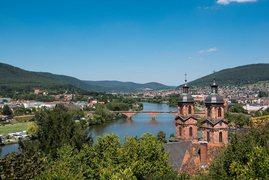 Miltenberg, Germany - July 24, 2019; View from the castle on the city of Miltenberg a touristic town on the romantic road in Bavaria on a sunny day with blue sky